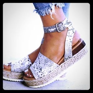 Brand new, never worn snake print espadrilles!